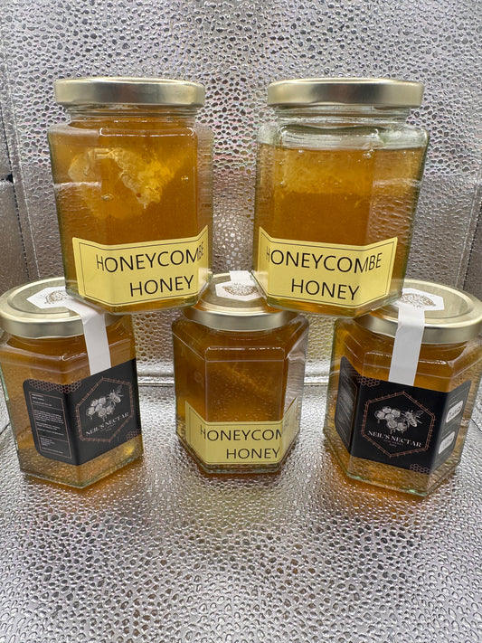 Neil's Nectar Honey 340g Jar with a natural piece of honeycomb within
