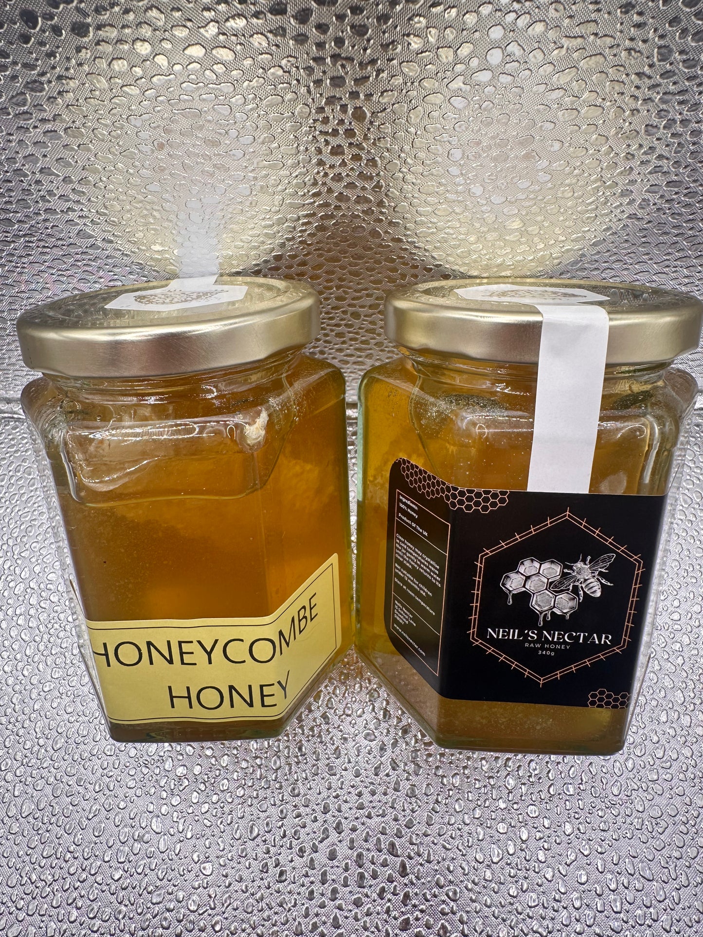 Neil's Nectar Honey 340g Jar with a natural piece of honeycomb within